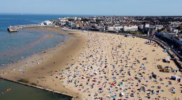 <p>Britons have been heading to the beach in the summer heat </p>