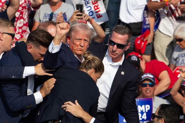 <p>Police get ready to climb a roof after Thomas Crooks opened fire on former president Donald Trump during a Pennsylvania rally. New body cam footage shows police confronting Crooks before the shooting and the chaotic scene in the aftermath. </p>