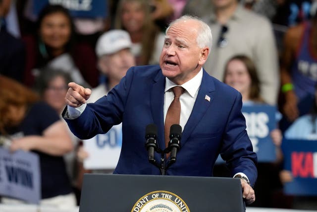 <p>Democratic vice presidential nominee Minnesota Gov. Tim Walz speaks at a campaign rally in Arizona. His campaign is trying to walk back his previous comments about using weapons “in war.” </p>