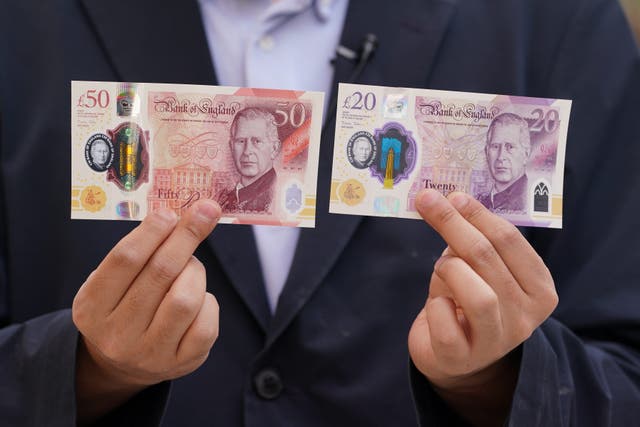 Banknotes featuring the new monarch entered circulation in June (Lucy North/PA)