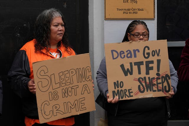 <p>Activists hold signs at a news conference opposing Mayor London Breed’s crackdown on homeless encampments in San Francisco, Tuesday, July 30, 2024. The city ramped up its programs that sent homeless individuals out of the city on August 8, 2024 as city shelters neared full capacity </p>