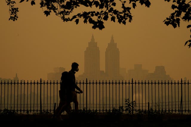 <p>People walk through a hazy Central Park in New York on June 7, 2023 after smoke from Canada's wildfires engulfed the Northeast. Fluctuations in air pollution can negatively impact people’s mood on a day-to-day basis, a new study revealed</p>