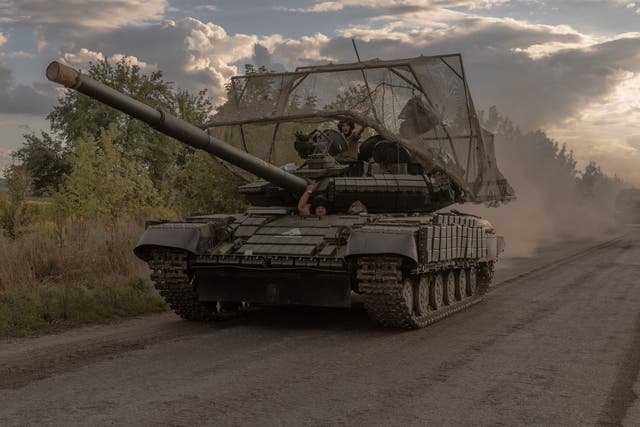 <p>Ukrainian servicemen drive Soviet-made T-64 tanks in the Sumy region, near the border with Russia</p>