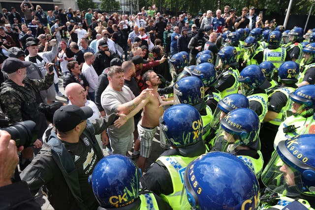 <p>Far-right rioters clashing with police in Manchester</p>