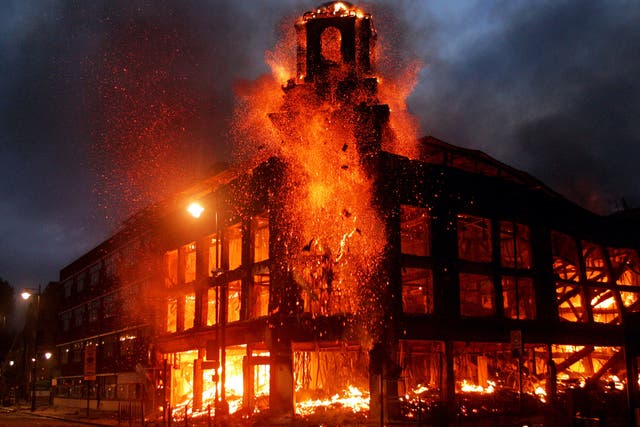 <p>Fire rages through a building in Tottenham during the 2011 riots</p>