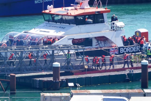 <p>A group of people thought to be migrants are brought in to Dover, Kent, from a Border Force vessel following a small boat incident in the Channel. </p>